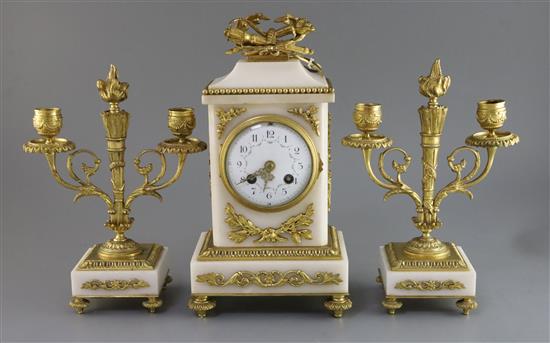 An early 20th century French ormolu and white marble clock garniture, 10in.